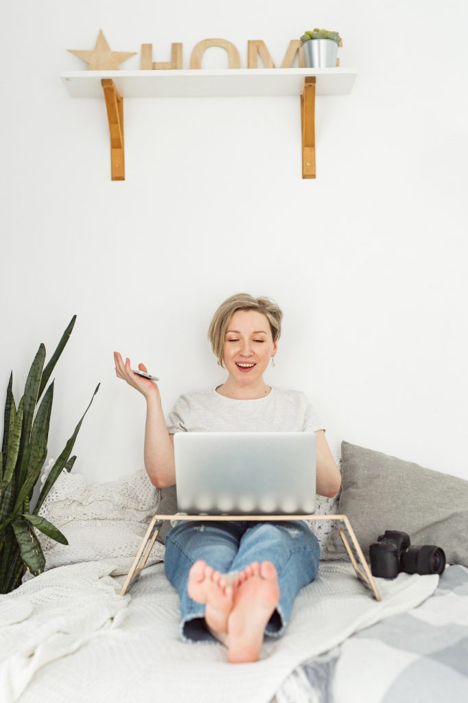 Woman sitting at laptop and working, freelance